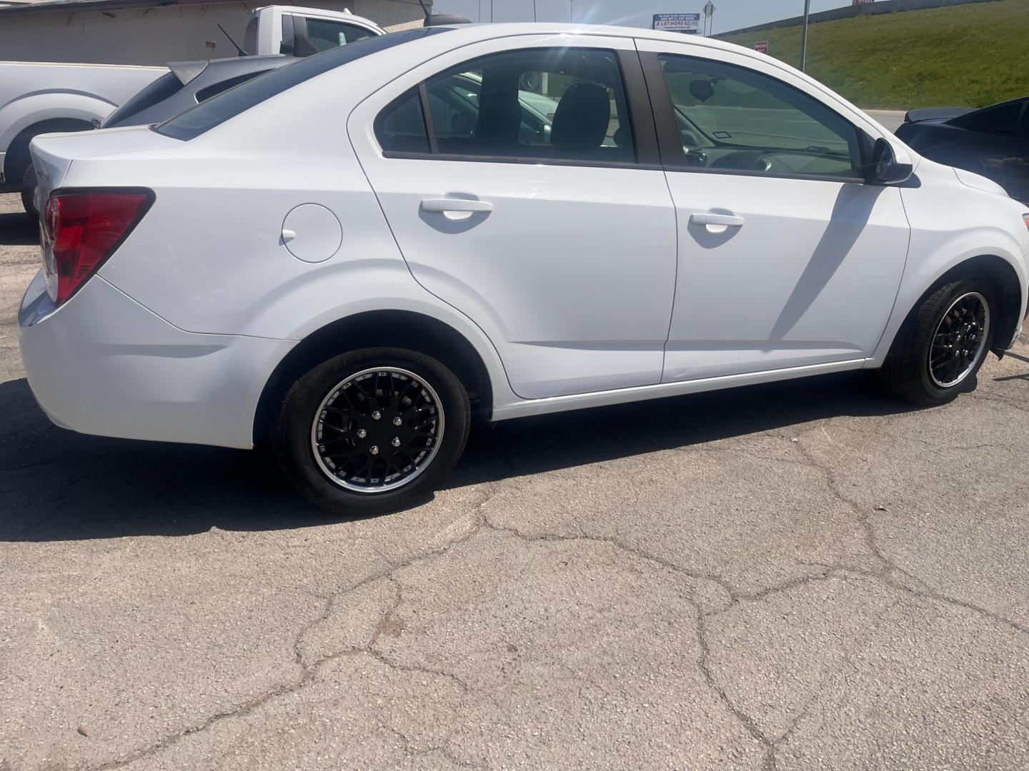 2016 WHITE Chevrolet Sonic LS Auto Sedan (1G1JA5SH9G4) with an 1.8L L4 DOHC 24V engine, 6A transmission, located at 8101 E. Skelly Dr., Tulsa, OK, 74129, (918) 592-3593, 36.121891, -95.888802 - Photo#1